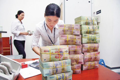 Hạ lãi suất, ngân hàng vẫn khó cho vay ảnh 1