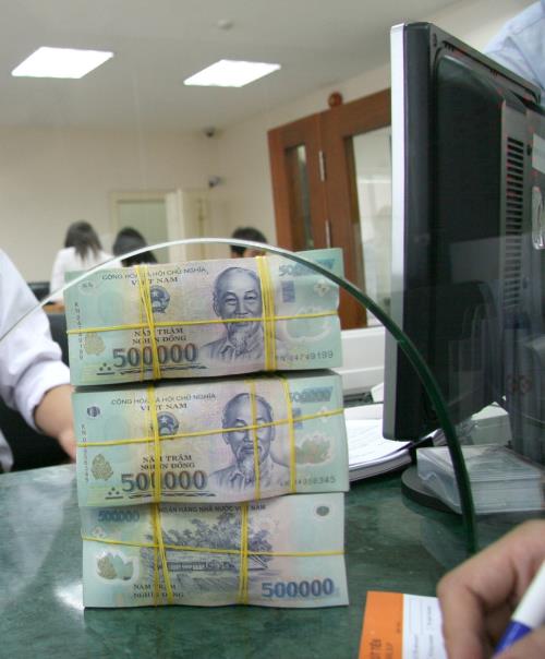 Ngân hàng tiếp tục hạ lãi suất huy động cuối năm ảnh 1