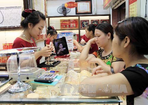 Vàng giảm giá, đô la Mỹ tăng nhẹ ảnh 1