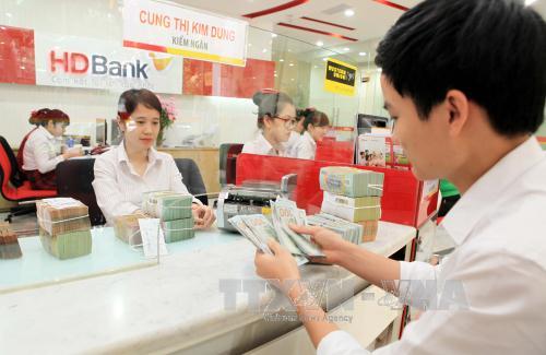 Chính phủ chỉ đạo giảm lãi suất cho vay ảnh 1