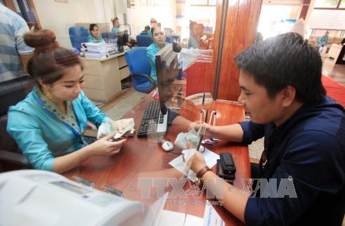 Nới biên độ tỷ giá là kịp thời và nhạy bén với thị trường ảnh 1