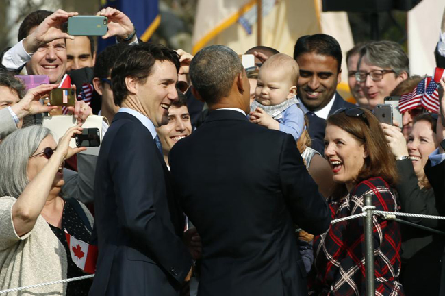 Tình cảm nồng ấm giữa ông Obama và Thủ tướng Canada gây sốt ảnh 10
