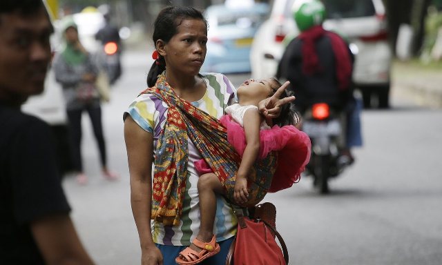 Nở rộ nghề "quá giang thu tiền" ở Indonesia ảnh 1